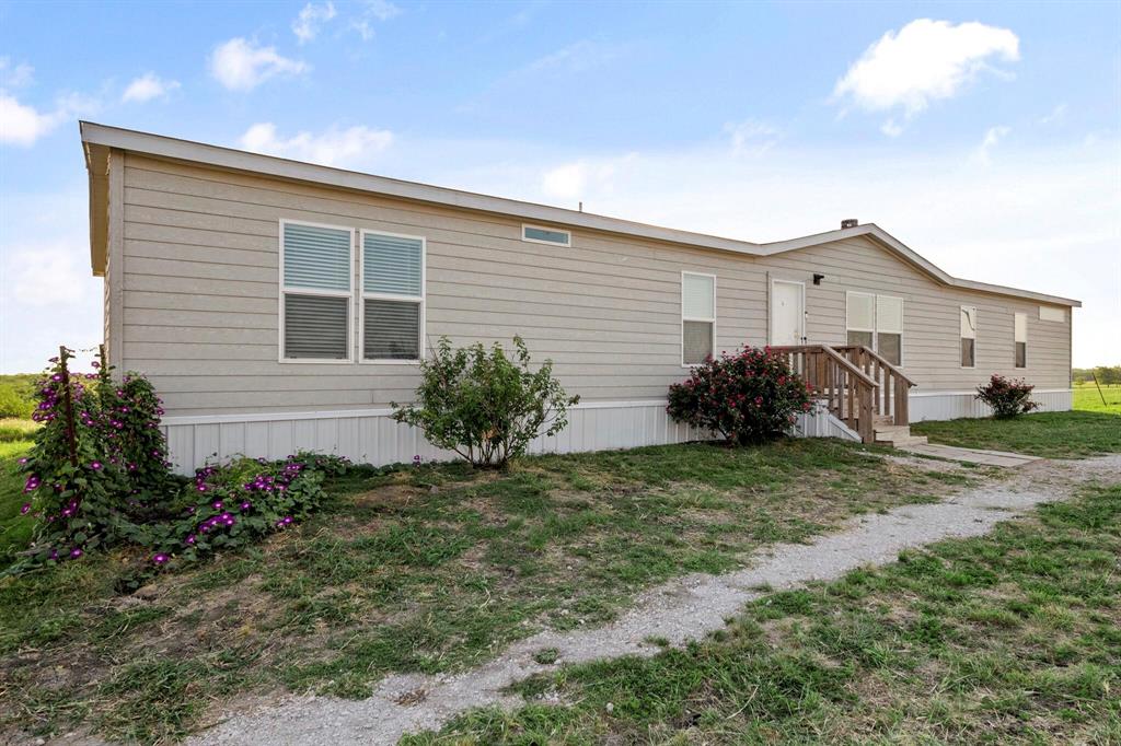 10026 County Rd NW 4350 Frost, TX 76641 - Photo 7 of 32 a view of a house with a yard