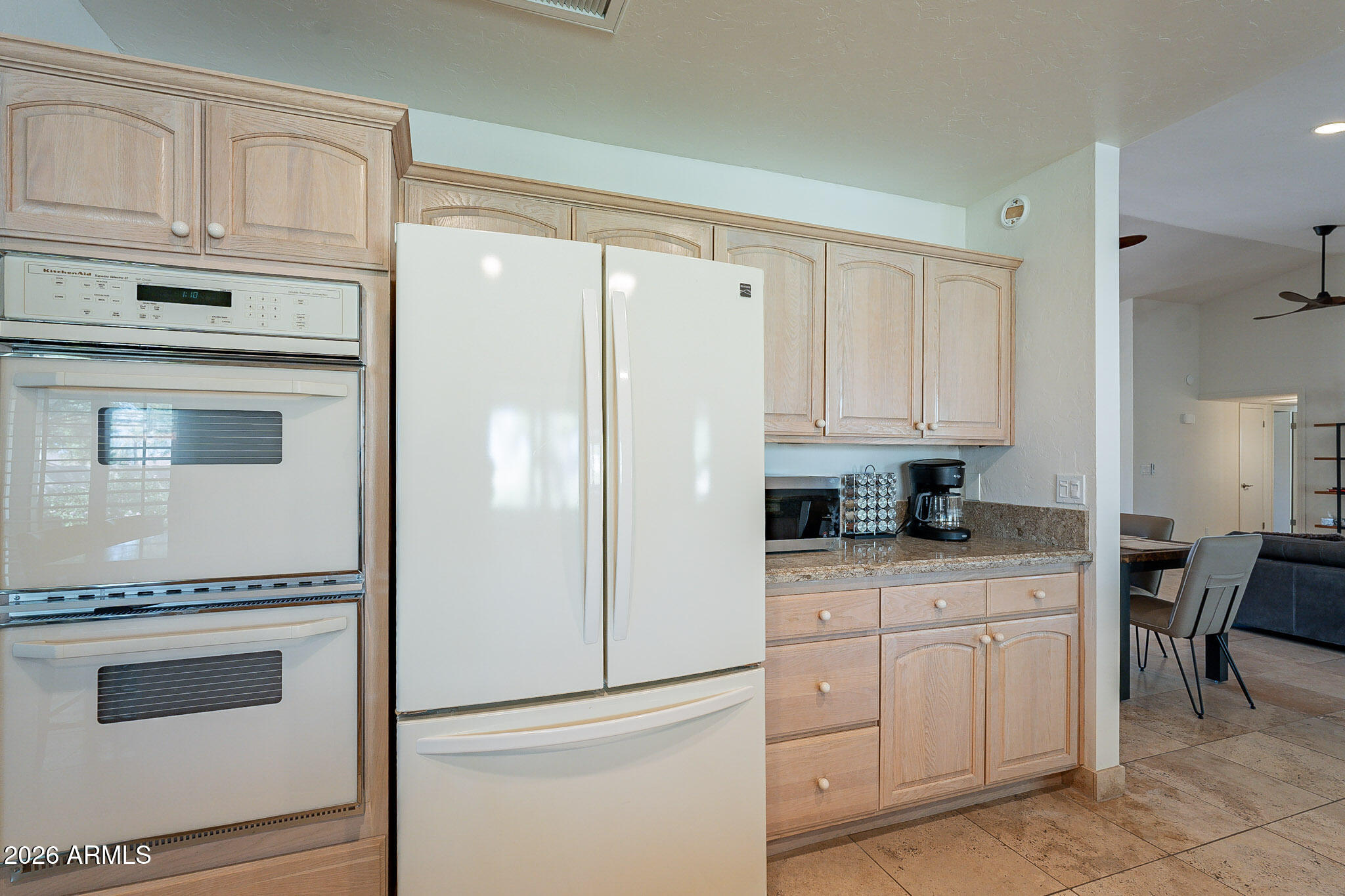 4226 East North Lane Phoenix, AZ 85028 - Photo 20 of 43 a kitchen with granite countertop white cabinets and white appliances
