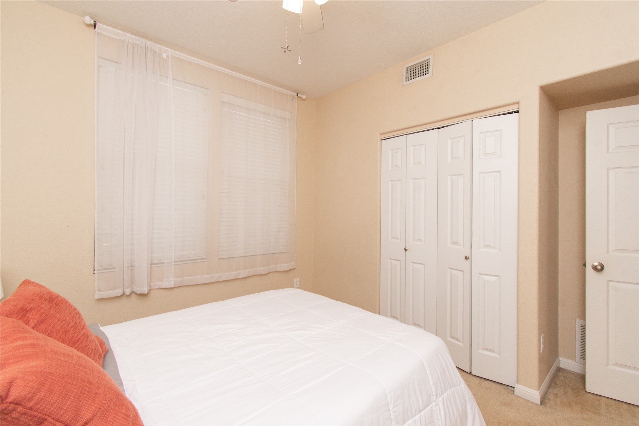 421 Shadow Point San Marcos, TX 78666 - Photo 17 of 24 Bedroom featuring light colored carpet and a closet