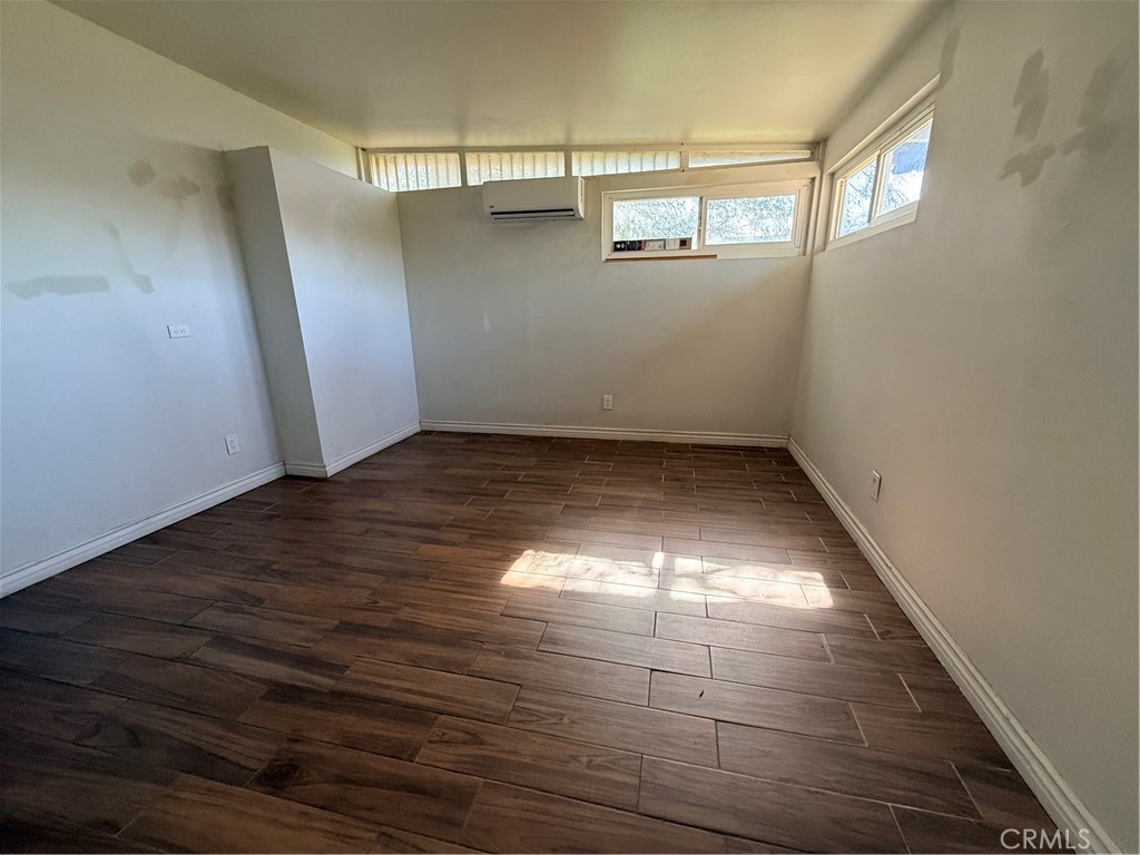 643 West Ramona Drive Rialto, CA 92376 - Photo 11 of 18 a view of empty room with wooden floor and fan