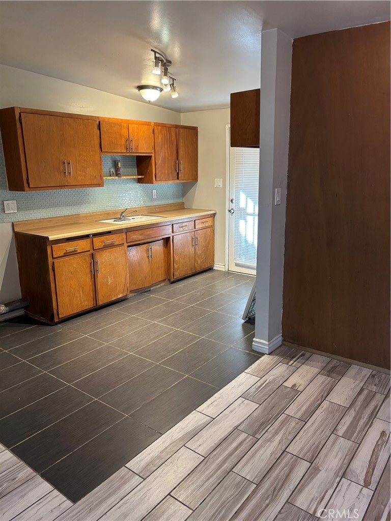 643 West Ramona Drive Rialto, CA 92376 - Photo 13 of 18 a spacious bathroom with a mirror and a sink