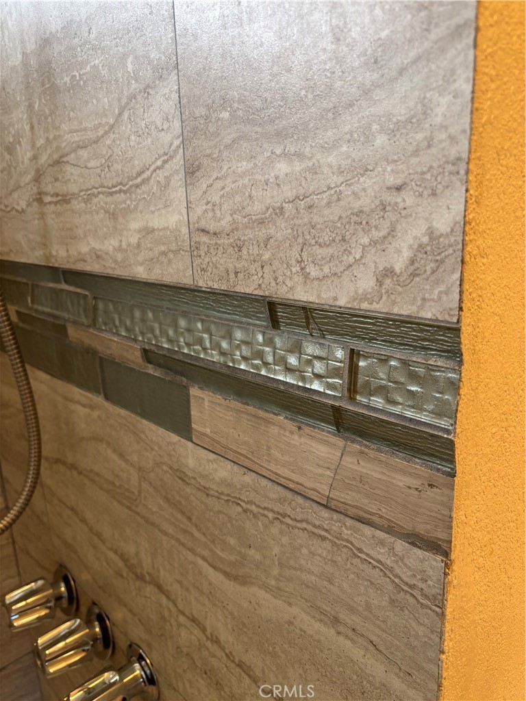 643 West Ramona Drive Rialto, CA 92376 - Photo 15 of 18 a bathroom with a shower