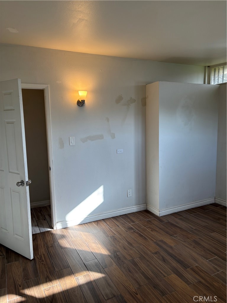643 West Ramona Drive Rialto, CA 92376 - Photo 17 of 18 a view of a living room with wooden floor and furniture