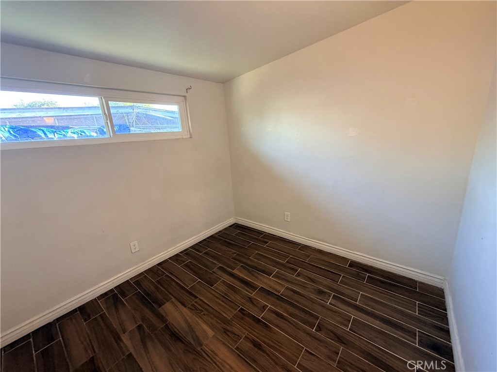 643 West Ramona Drive Rialto, CA 92376 - Photo 10 of 18 a view of a room with wooden floor