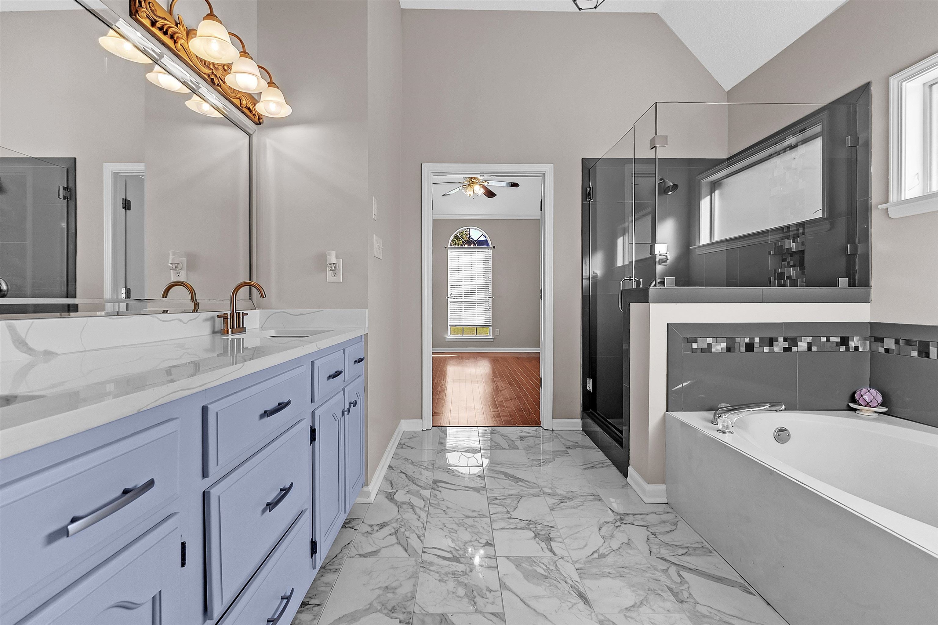 6700 Beagle Lane Bartlett, TN 38002 - Photo 25 of 40 a spacious bathroom with a tub sink and mirror