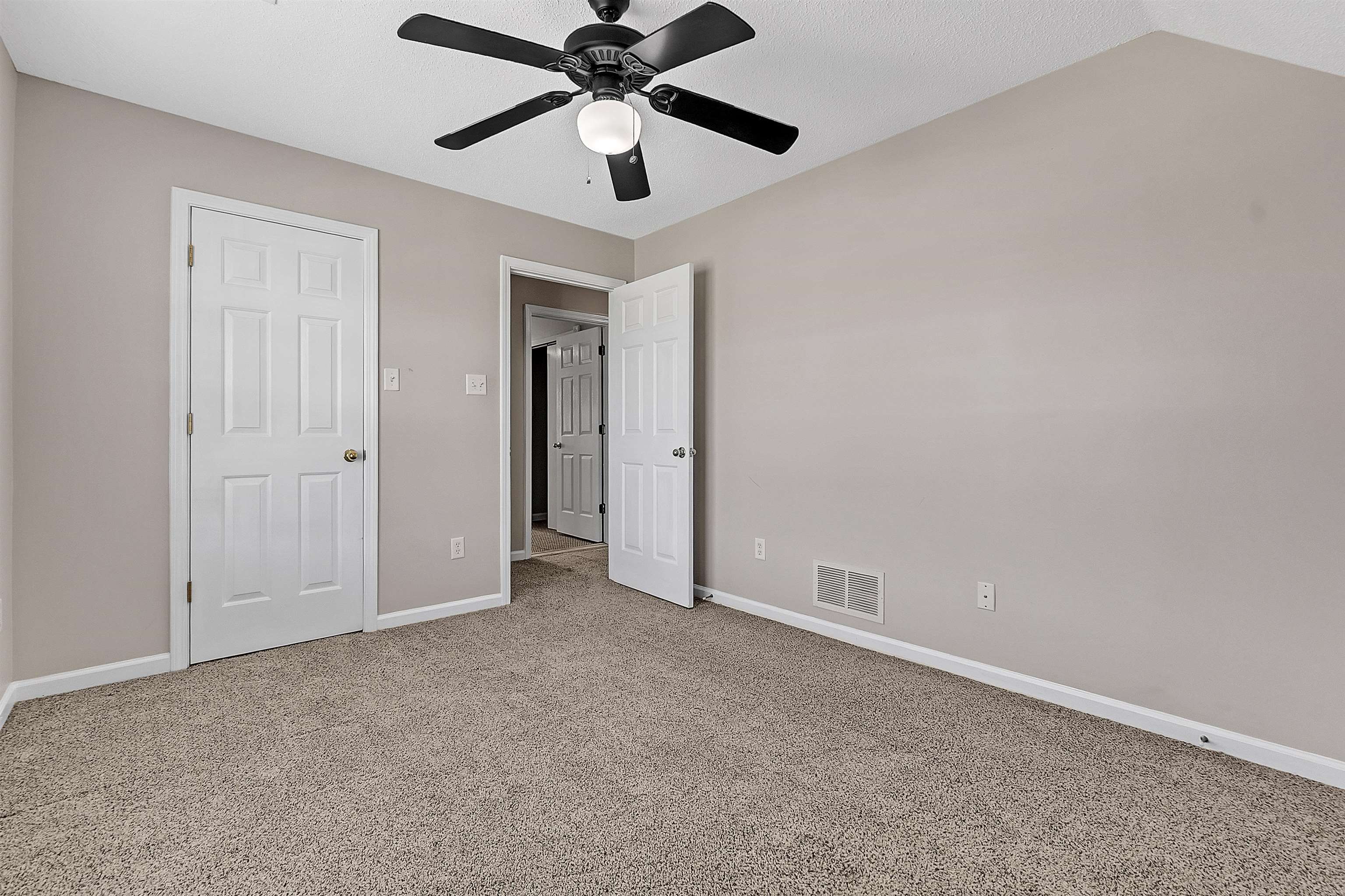 6700 Beagle Lane Bartlett, TN 38002 - Photo 30 of 40 an empty room with chandelier fan