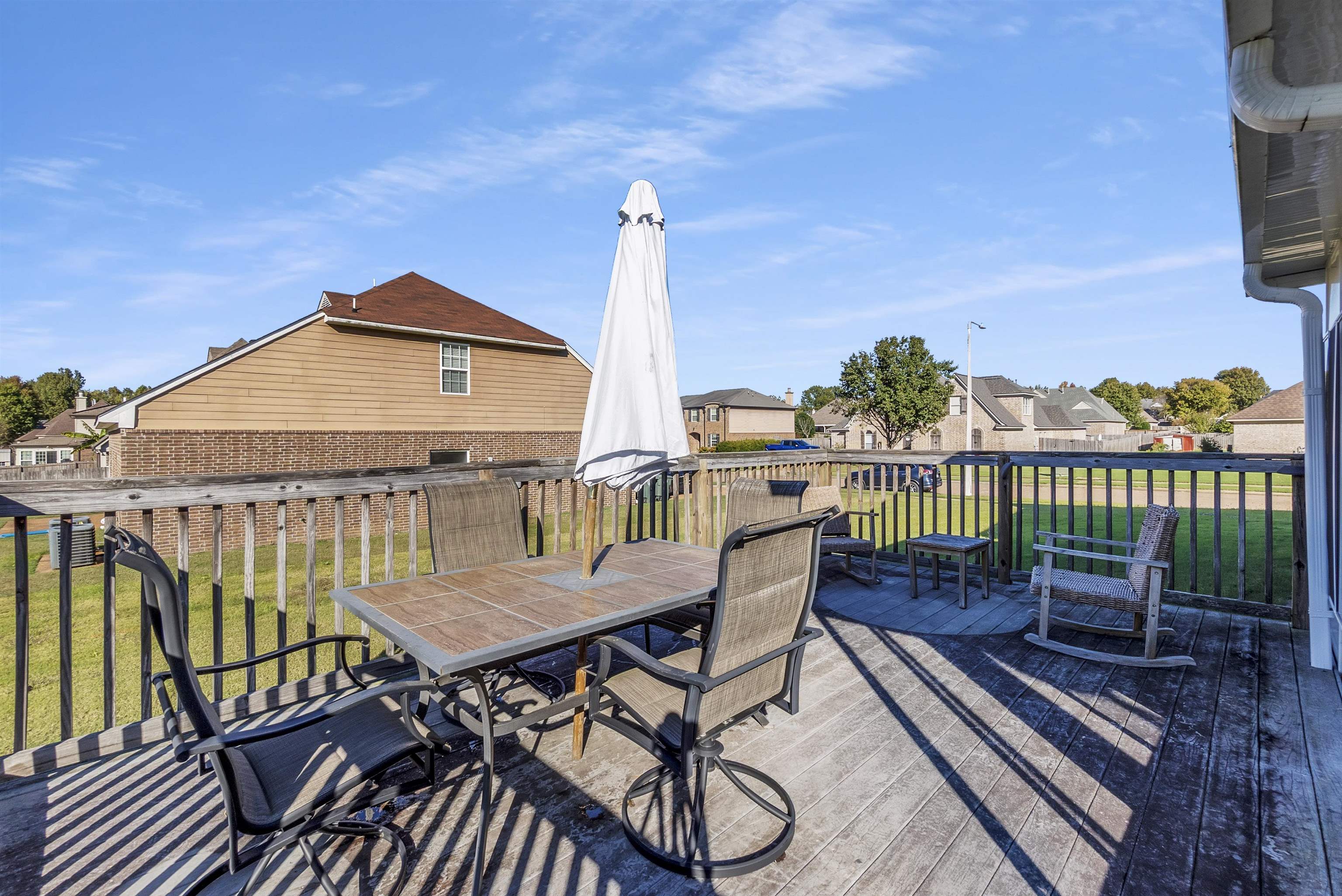 6700 Beagle Lane Bartlett, TN 38002 - Photo 35 of 40 a view of a chairs and table on the deck