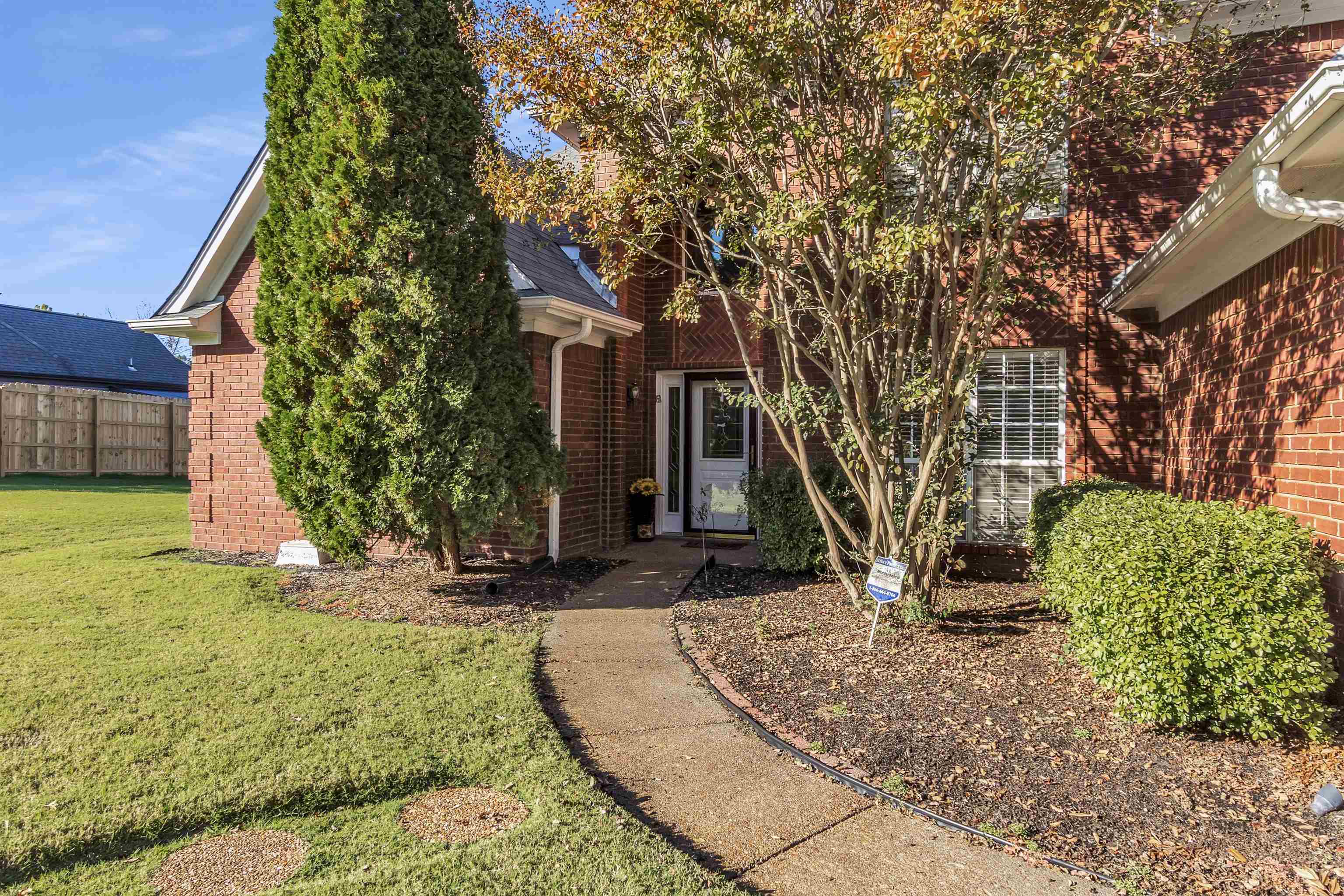 6700 Beagle Lane Bartlett, TN 38002 - Photo 6 of 40 a front view of a house with garden
