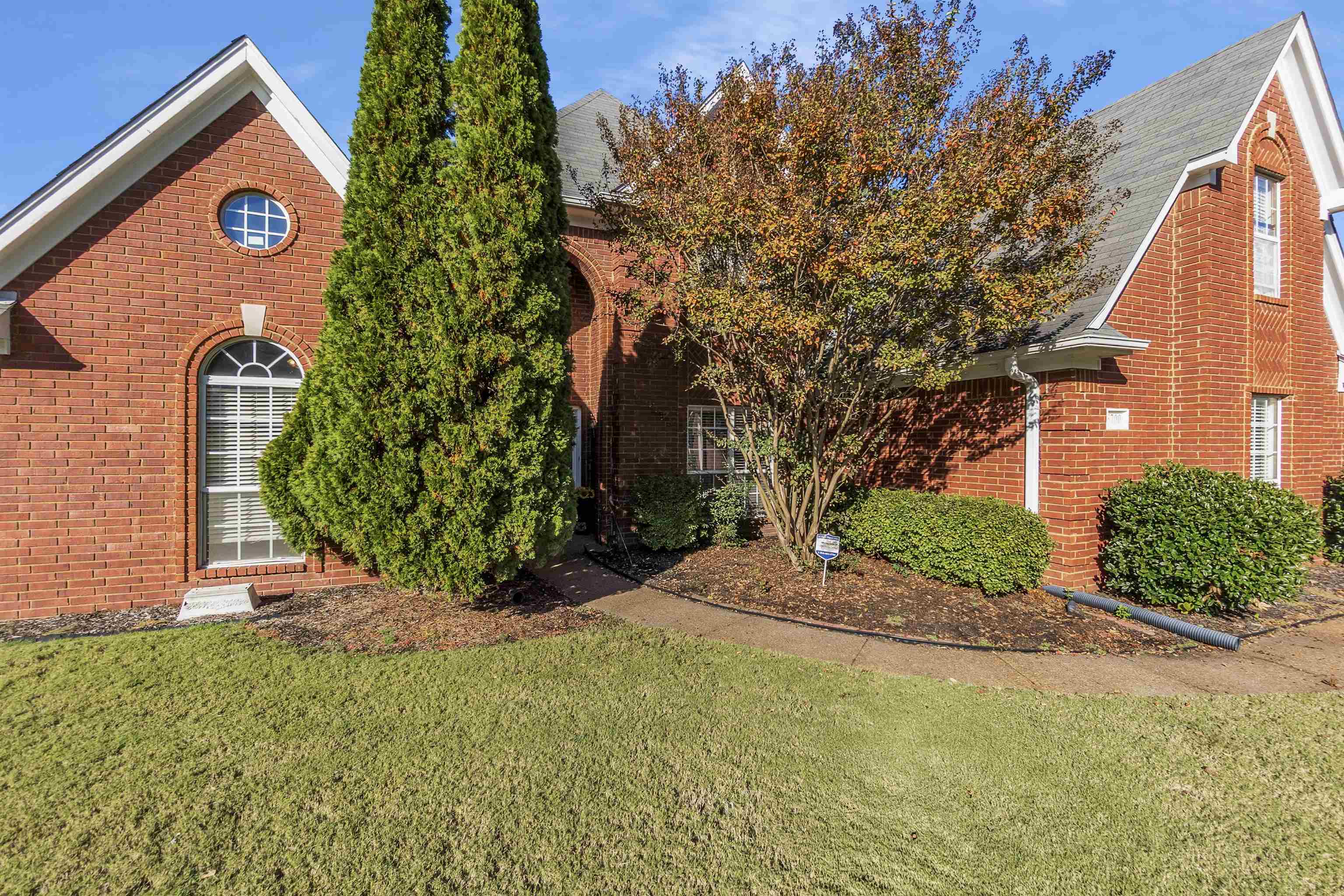 6700 Beagle Lane Bartlett, TN 38002 - Photo 8 of 40 a front view of a house with garden