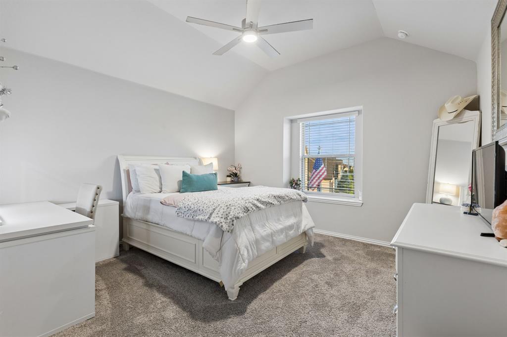 1023 Ridgehurst Road Melissa, TX 75454 - Photo 29 of 39 Spacious room featuring vaulted ceilings, a ceiling fan with integrated lighting, window with blinds, and neutral-toned carpeting