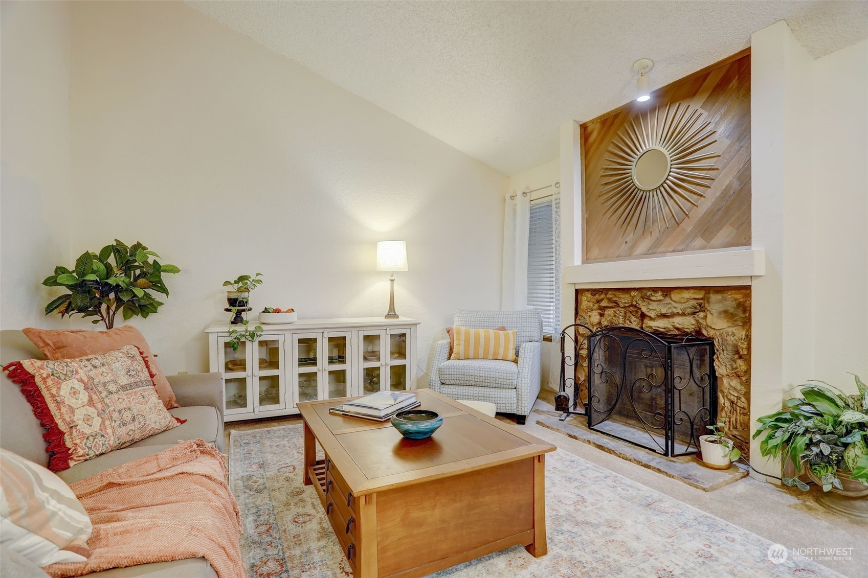14401 Southeast Petrovitsky Road, Unit D204 Renton, WA 98058 - Photo 3 of 25 a living room with furniture and a fireplace