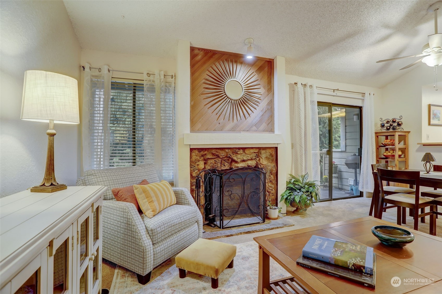 14401 Southeast Petrovitsky Road, Unit D204 Renton, WA 98058 - Photo 4 of 25 a living room with furniture and a fireplace