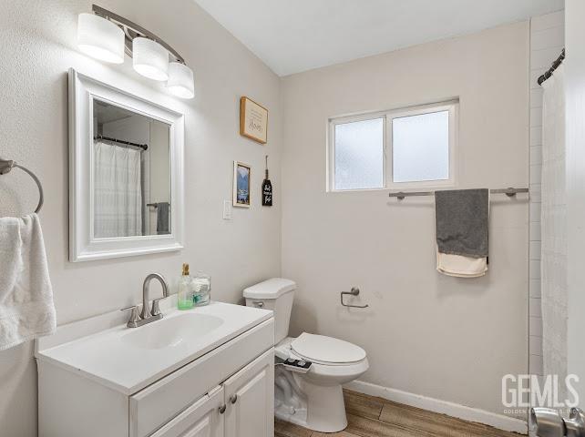 Undisclosed Address Shafter, CA 93263 - Photo 11 of 21 a bathroom with a toilet sink and mirror
