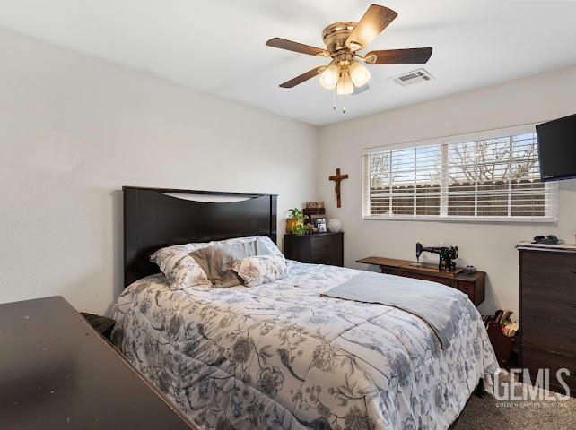 Undisclosed Address Shafter, CA 93263 - Photo 12 of 21 a bedroom with a bed and window