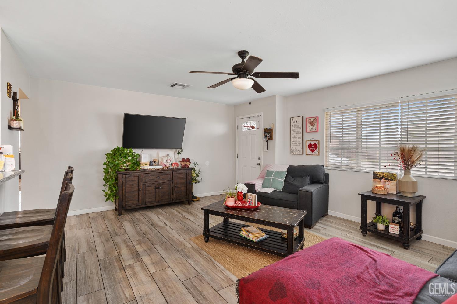 Undisclosed Address Shafter, CA 93263 - Photo 5 of 21 a living room with furniture a window and a flat screen tv