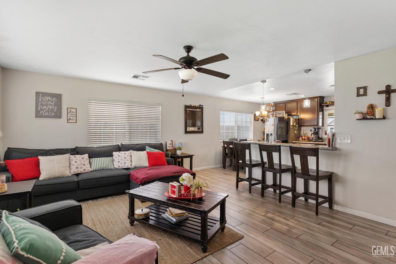 Undisclosed Address Shafter, CA 93263 - Photo 6 of 21 a living room with furniture and a wooden floor