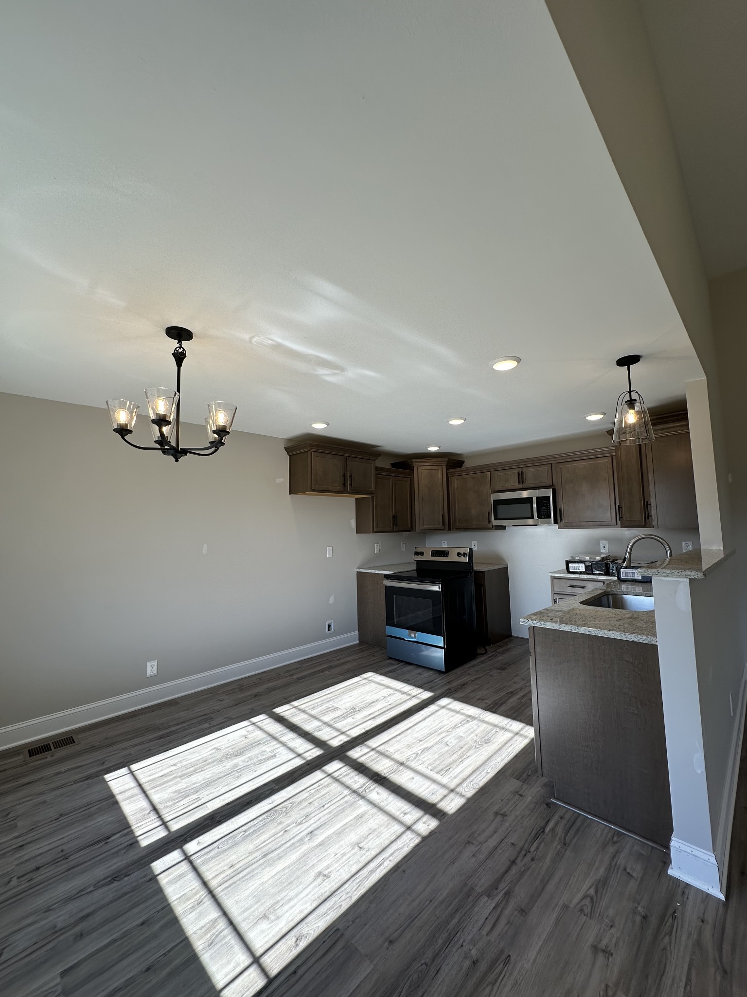 104 Cherry Fields Clarksville, TN 37042 - Photo 11 of 18 a kitchen with kitchen island a stove sink and cabinets