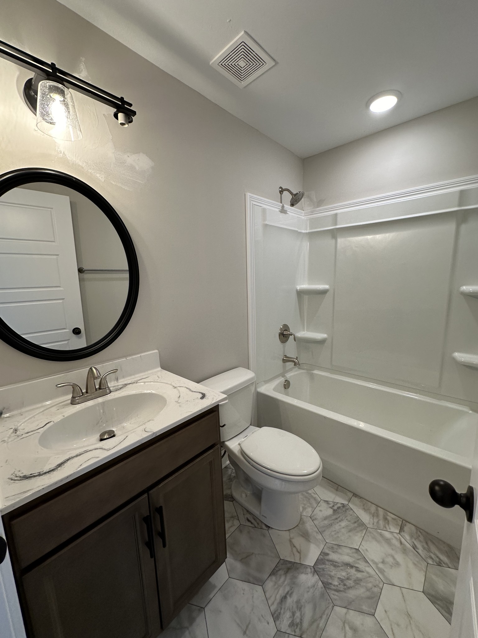 104 Cherry Fields Clarksville, TN 37042 - Photo 6 of 18 a bathroom with a granite countertop sink toilet mirror vanity and bathtub