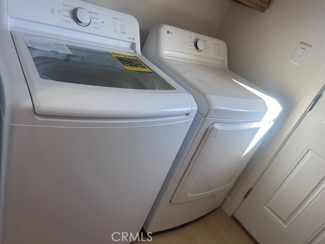 20754 Vose Street Winnetka, CA 91306 - Photo 13 of 32 a utility room with dryer and washer