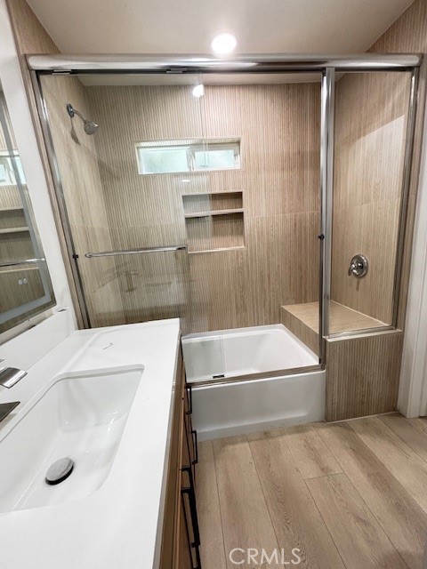 20754 Vose Street Winnetka, CA 91306 - Photo 17 of 32 a bathroom with a sink a toilet and shower