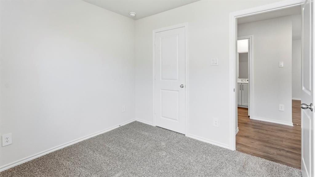 3526 Spring Time Street Forney, TX 75126 - Photo 17 of 27 Neutral bedroom featuring light gray carpet flooring and white painted walls
