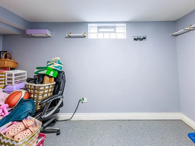 a view of a balcony with chairs and wooden floor