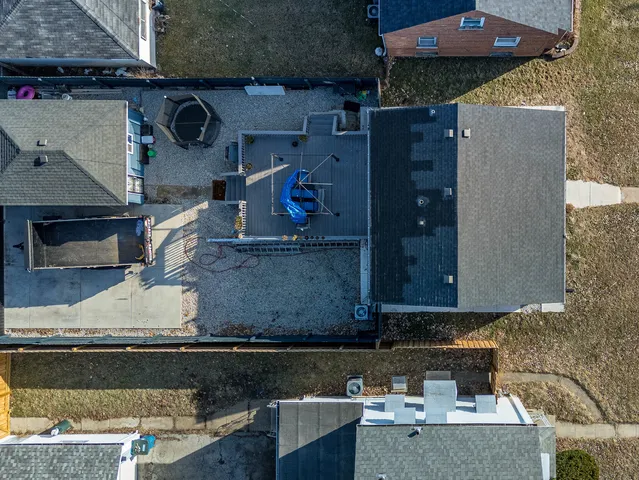 a view of empty room with wooden floor and window