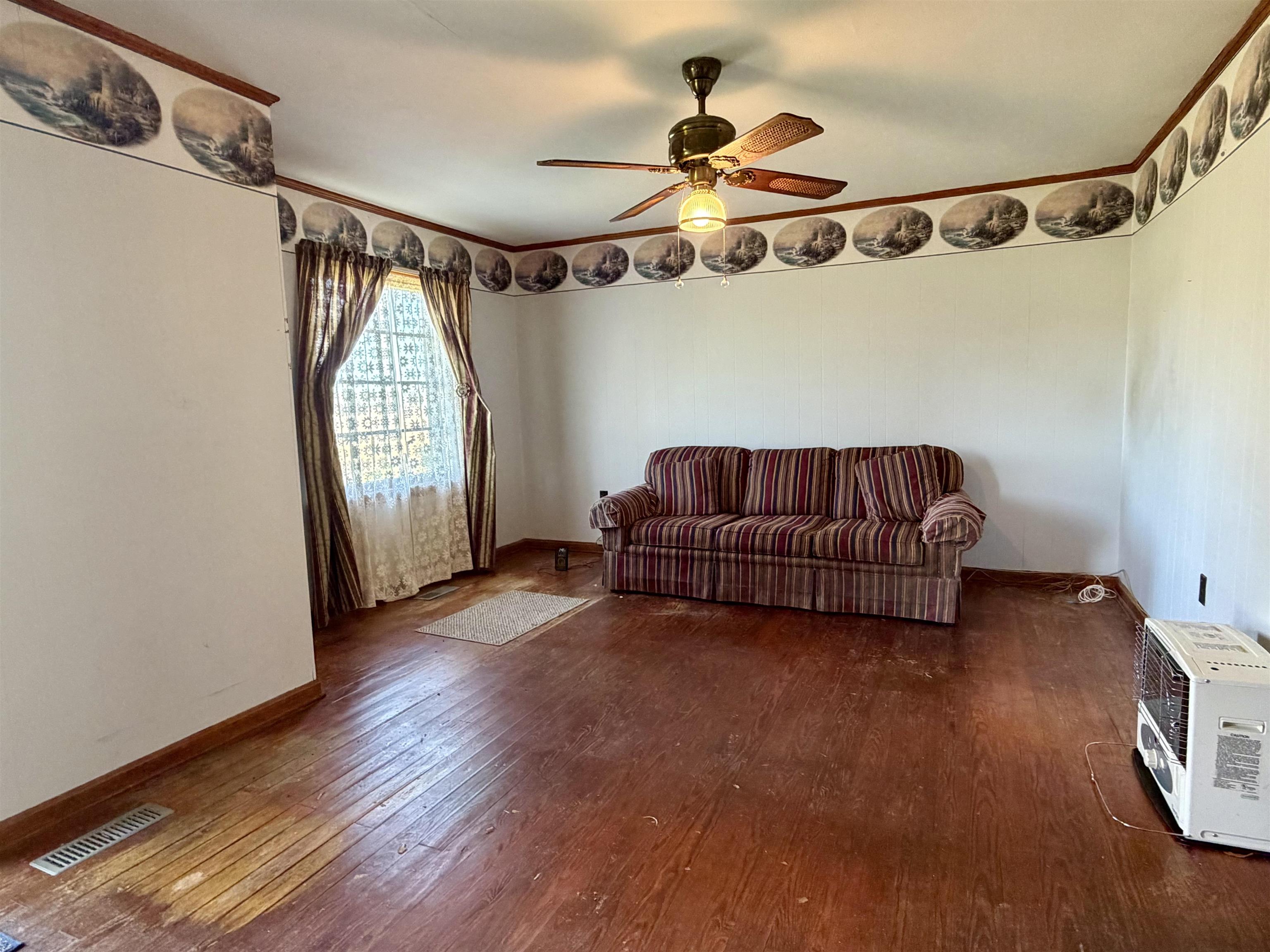 218 Sardie Henry Road Bethel Springs, TN 38315 - Photo 2 of 18 Living room with hardwood / wood-style flooring and ceiling fan