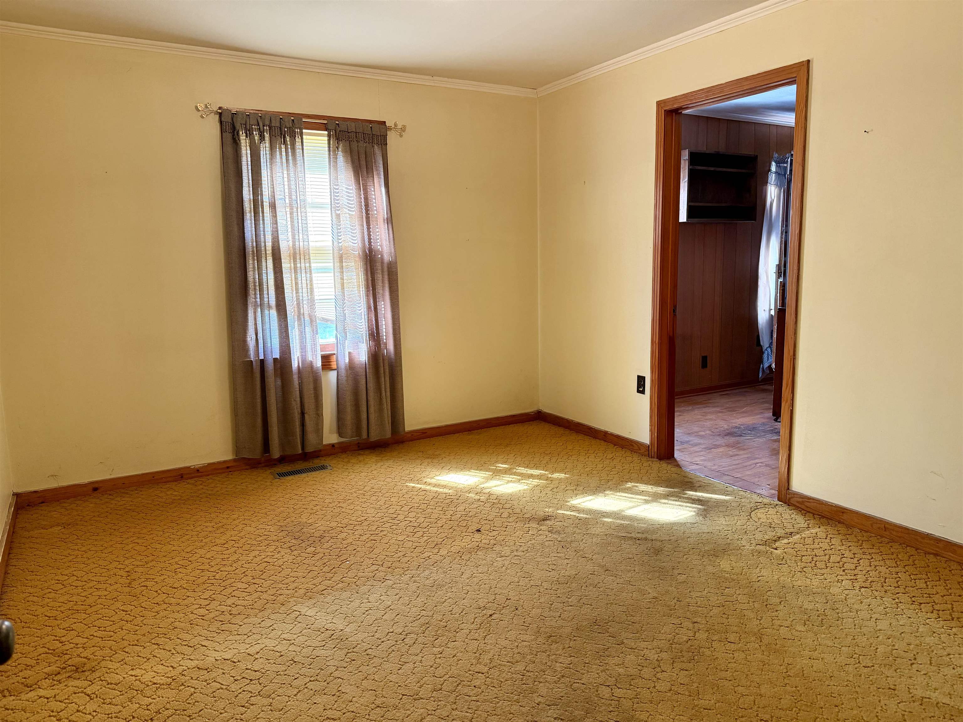 218 Sardie Henry Road Bethel Springs, TN 38315 - Photo 10 of 18 Spare room with light carpet and ornamental molding