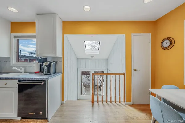 a view of a livingroom with furniture and front door