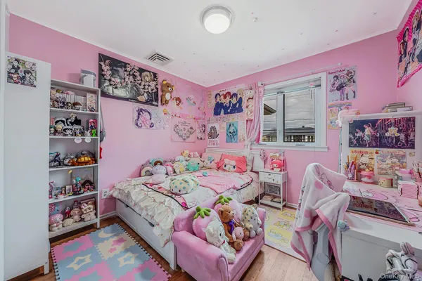 a bedroom with toys and a bed