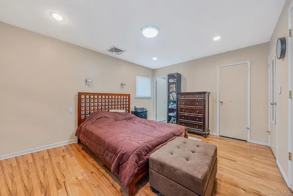 a bed room with a bed and a television