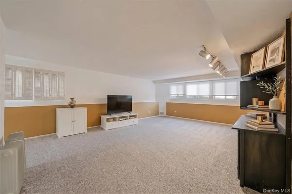 a view of a livingroom with furniture and a fireplace