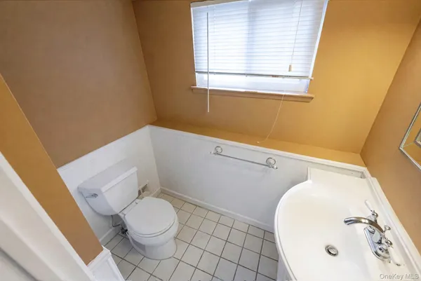 a bathroom with a toilet and a sink