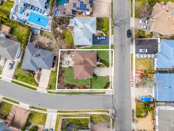 an aerial view of residential houses with outdoor space