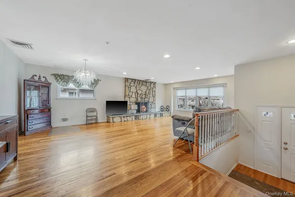 a view of a livingroom with furniture and a kitchen