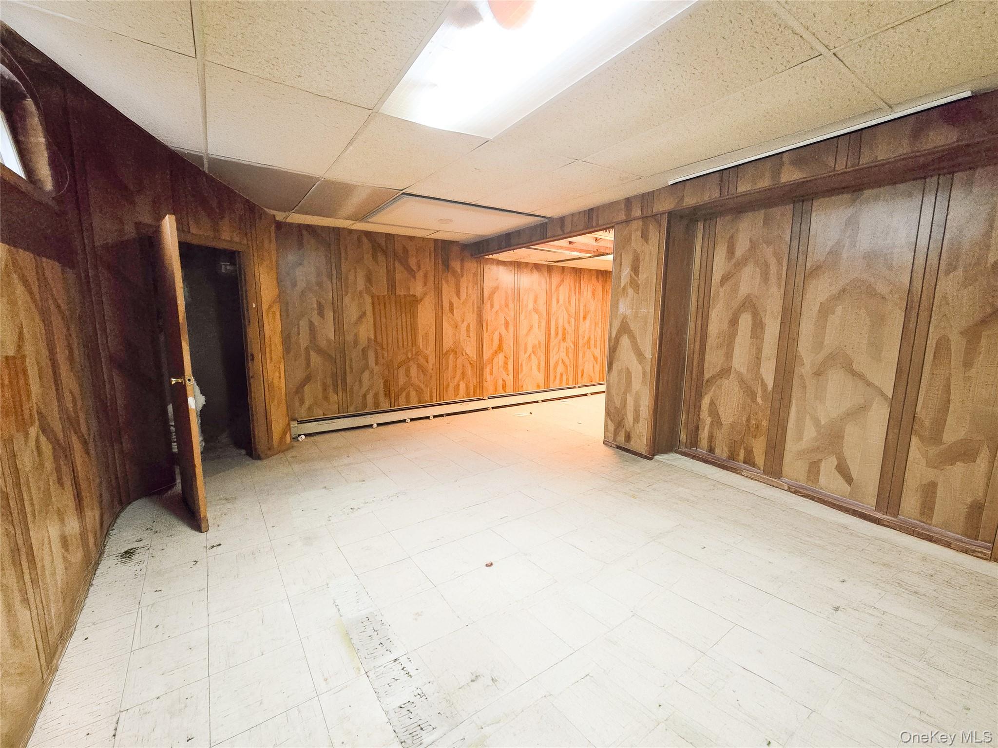 95-32 95th Street Queens, NY 11416 - Photo 18 of 20 a view of an empty room with a window