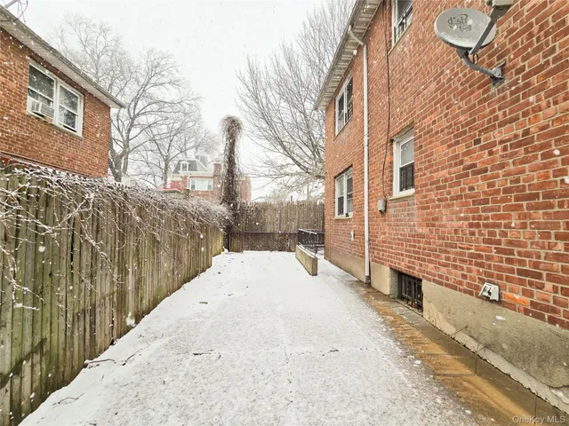 a view of a backyard of the house