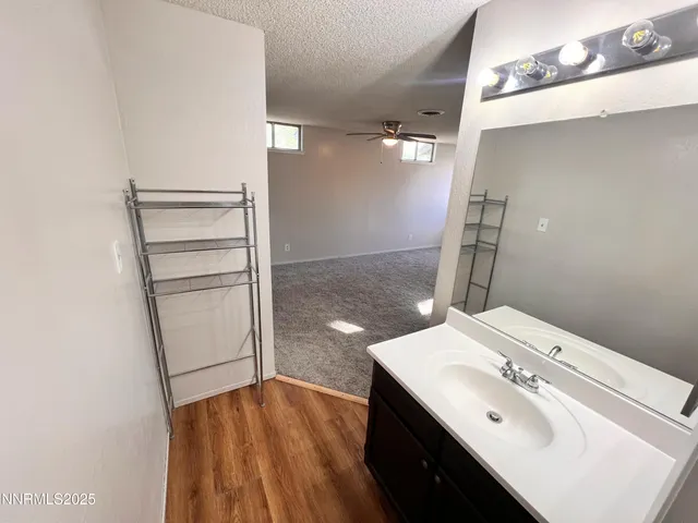 a white toilet sitting next to a bathroom sink