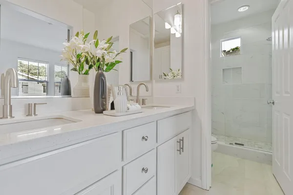 a bathroom with a sink a vanity and a bathtub
