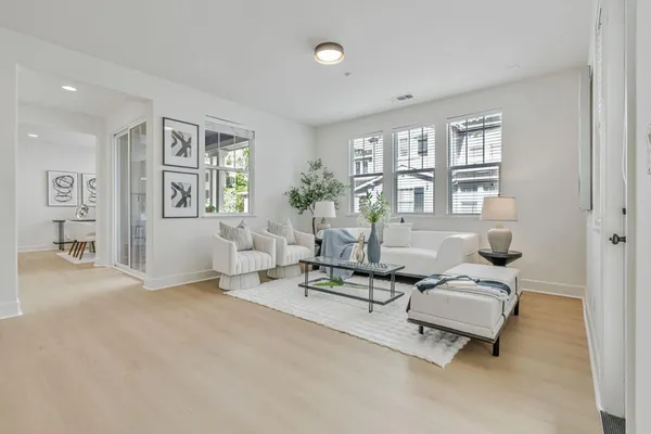 a living room with furniture and windows