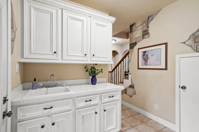 a kitchen with a sink and cabinets
