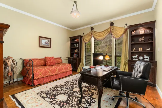 a living room with furniture and lamp