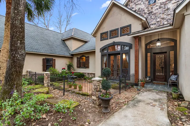 a front view of a house with garden