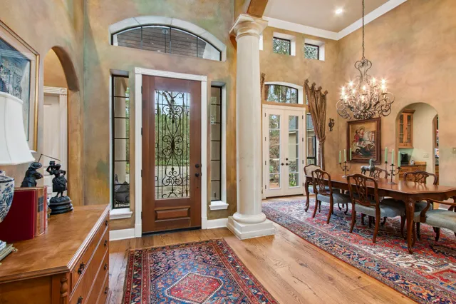 a view of a livingroom with furniture window and wooden floor