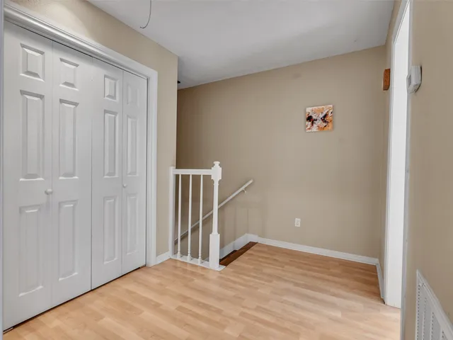 a view of a livingroom with wooden floor