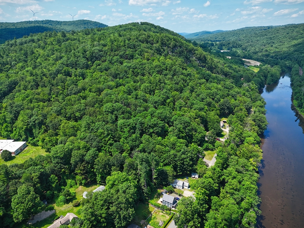 81 Pomeroy Terrace Russell, MA 01071 - Photo 3 of 15 a view of a lush green forest with lots of trees