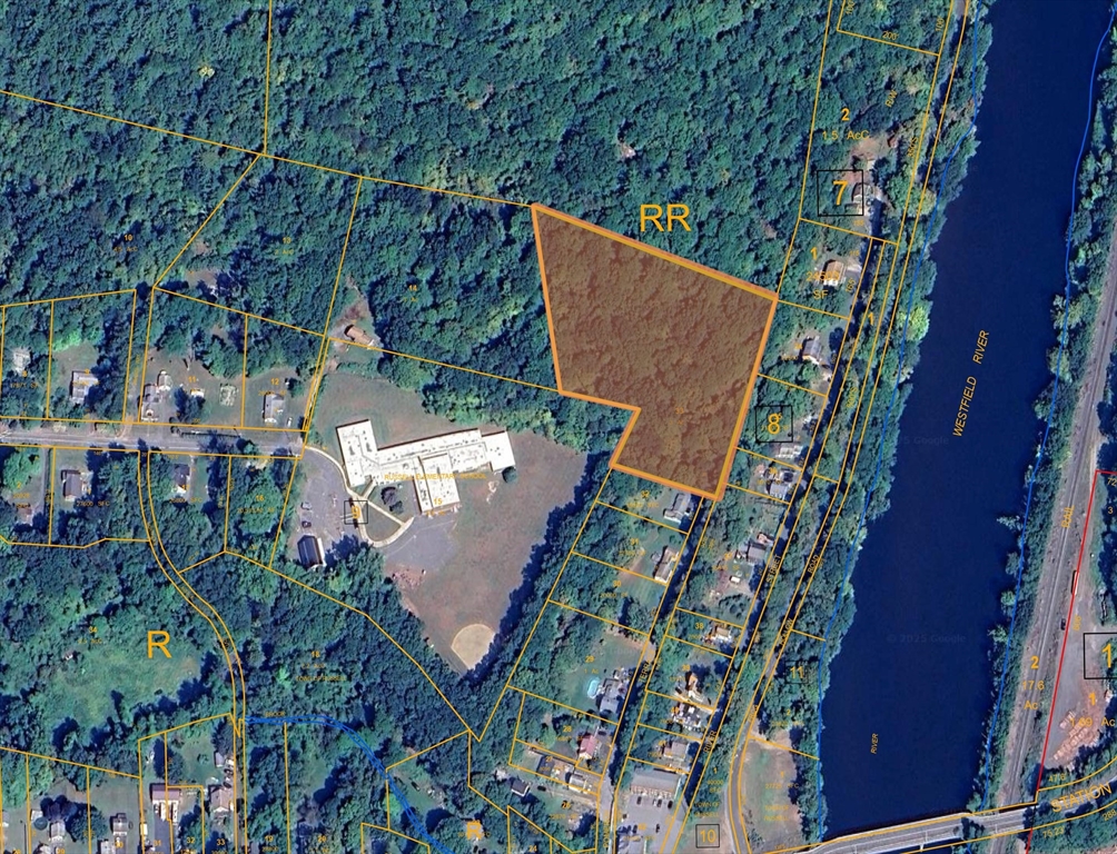 81 Pomeroy Terrace Russell, MA 01071 - Photo 4 of 15 an aerial view of a house with a yard and trees all around