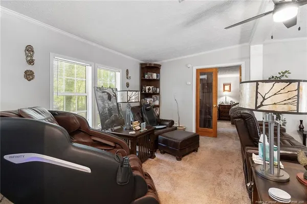 a living room with furniture and a window