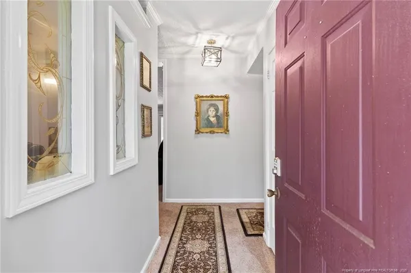 a view of an entryway with a rug